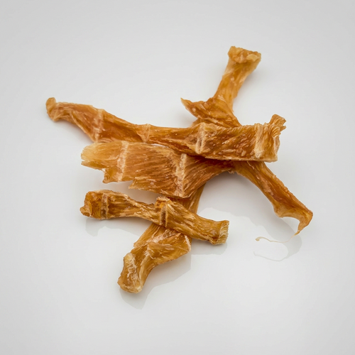 Dog treats shaped like bones on a white background