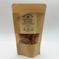 A stand-up kraft paper pouch of Rainey Dog Ranch Good Dog Fry Bites, featuring a clear window showing the brown fried dog treats inside, set against a plain white background.